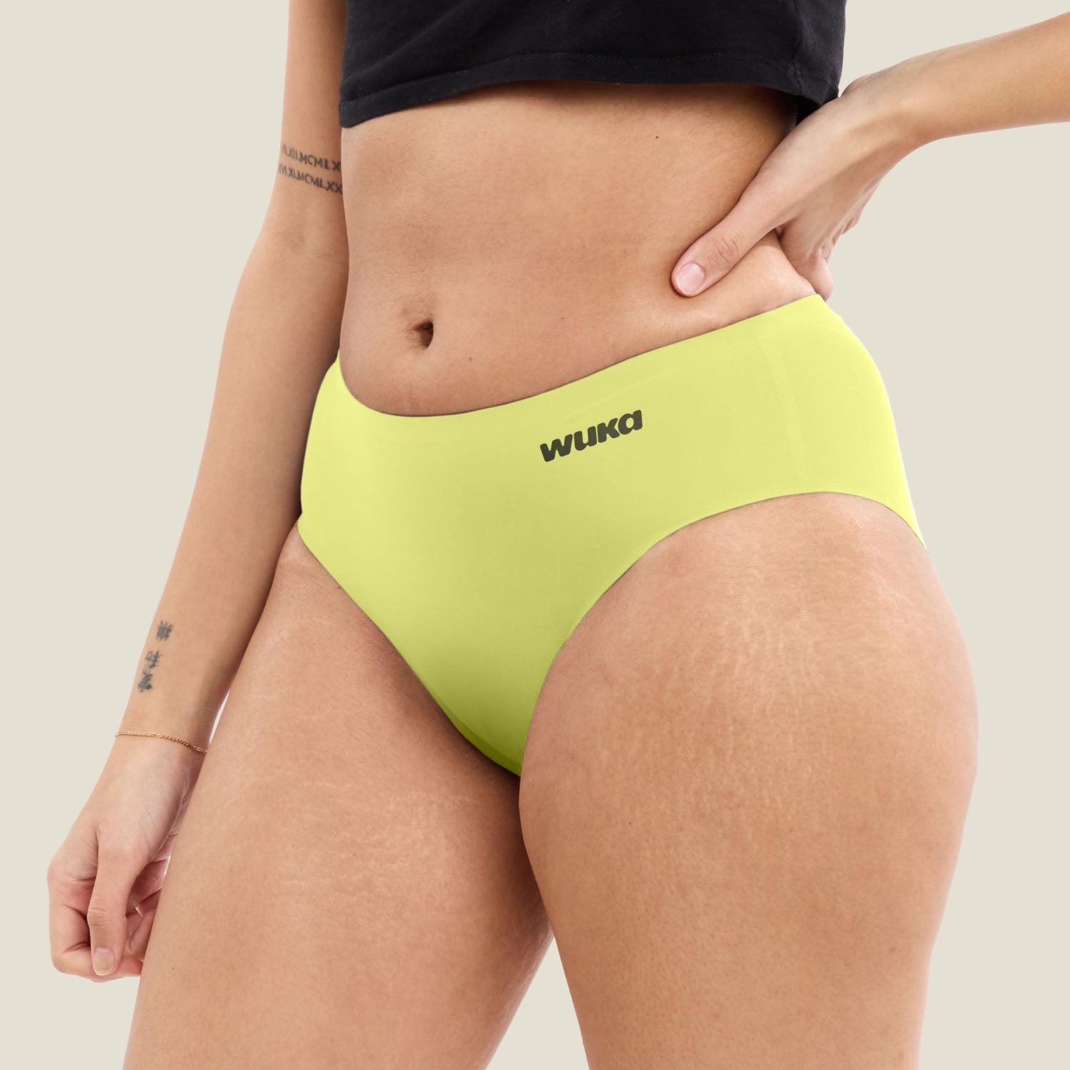 Side view of WUKA Teen Stretch Midi Brief in limited edition Lime Punch. Heavy flow period underwear with soft stretch and discreet protection.