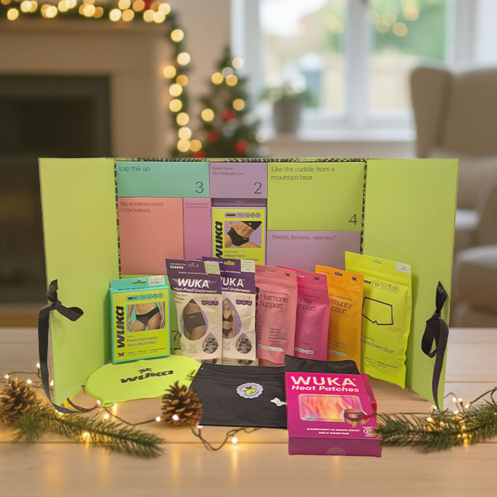 WUKA Period Positive Advent Calendar fully opened with 12 cycle care gifts including period pants, gummies and accessories