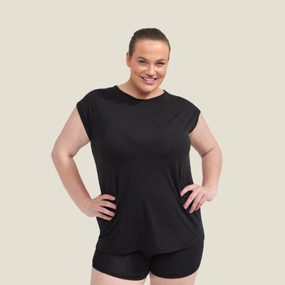 Front view of WUKA Menopause Pyjama Jersey T-Shirt in black, worn by plus size model, breathable and temperature-regulating sleepwear.