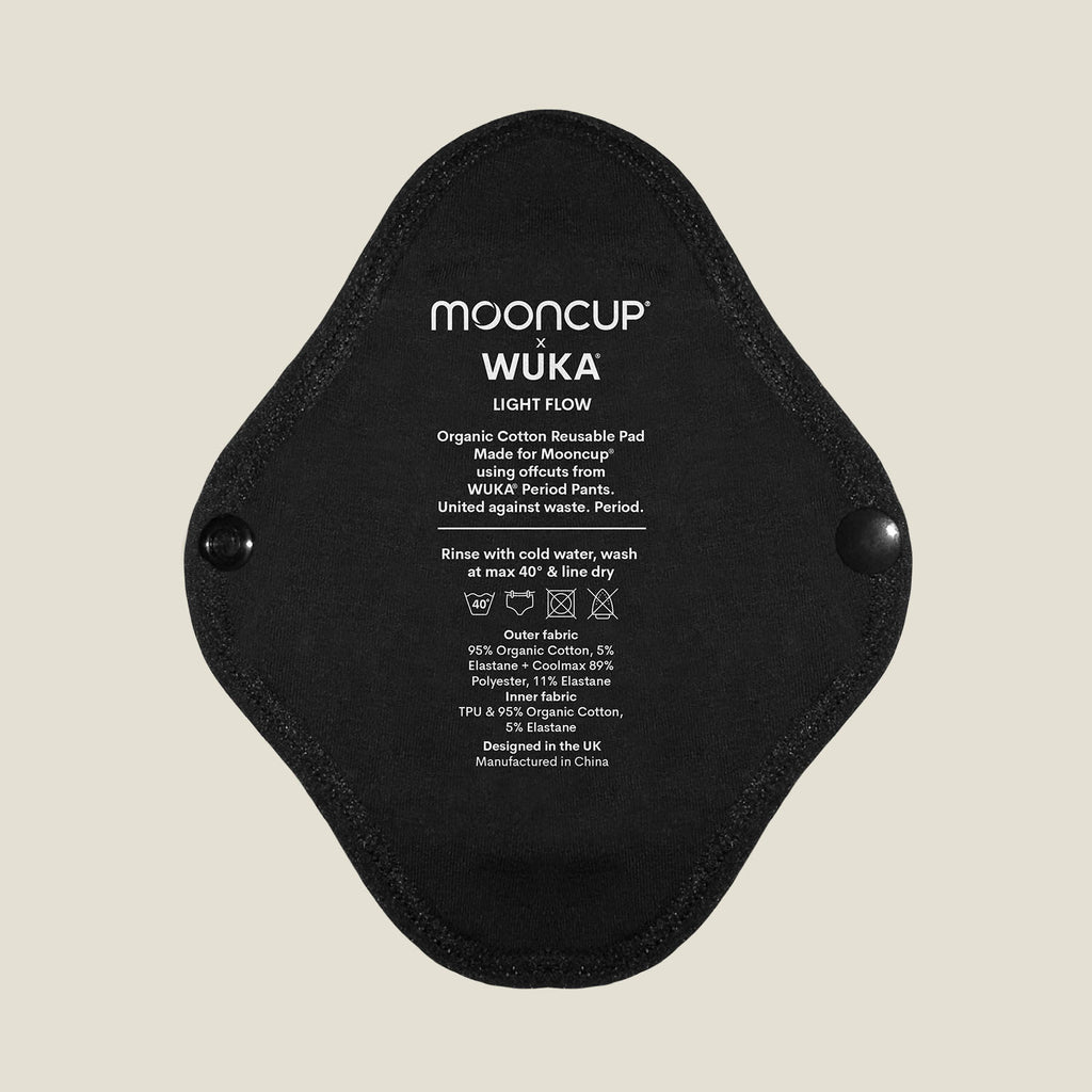 WUKA x Mooncup reusable panty liner for light flow with printed care instructions, made using soft and breathable organic cotton for daily comfort.