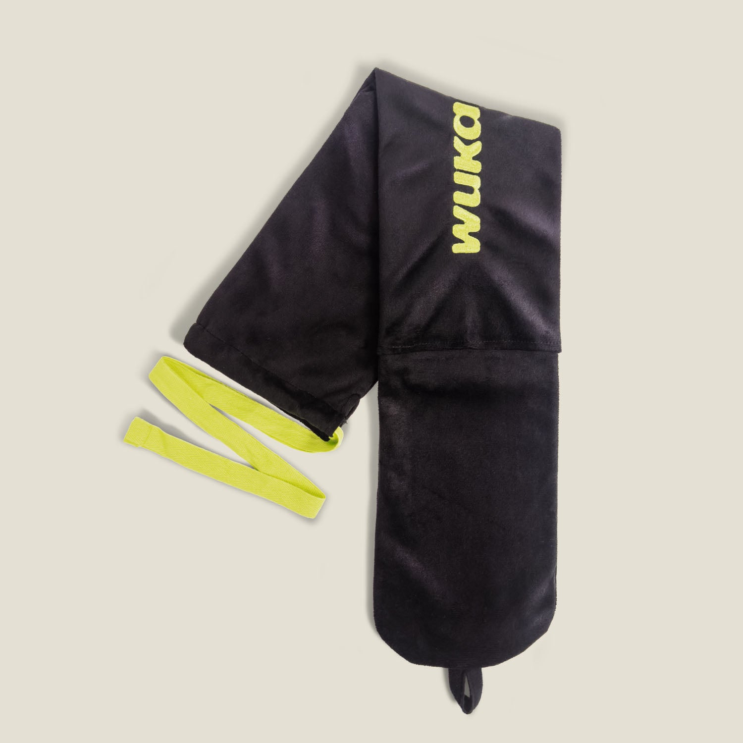 Product shot of WUKA extra-long hot water bottle with fleece cover and yellow tie straps