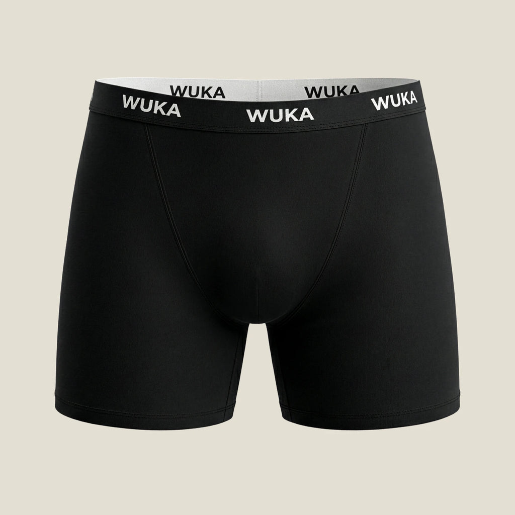 Flat lay of WUKA Ultimate™ Boxer Medium Flow Period Shorts in black, showing seamless, modern design with WUKA logo waistband for everyday period protection